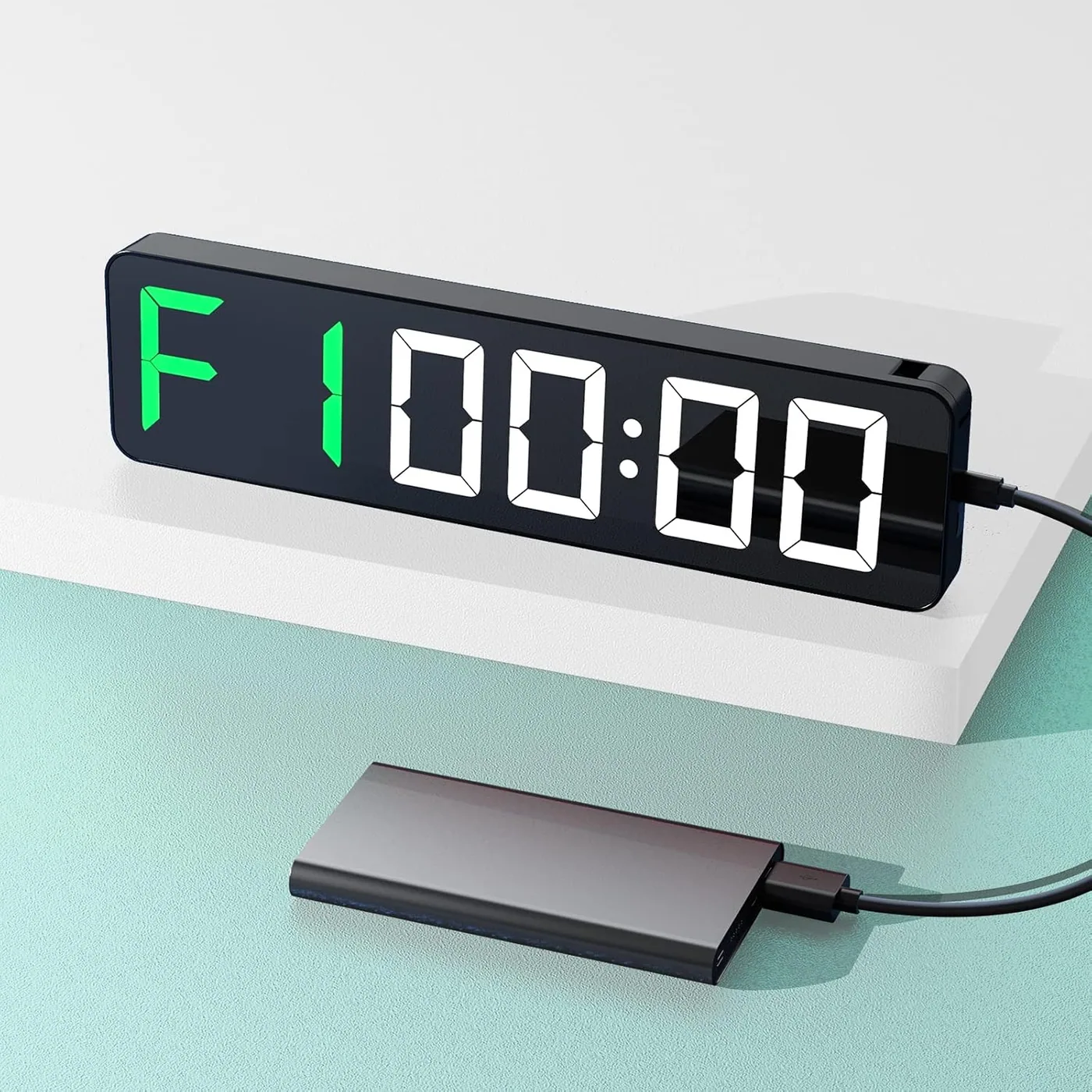 The portable timer runs from its own cell and charges by USB-C, so it spends its life in a gym bag rather than on a wall.